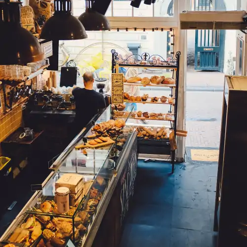 aerial view of a man behind the counter of a bakery