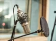 microphone and pop filter set up in a recording studio
