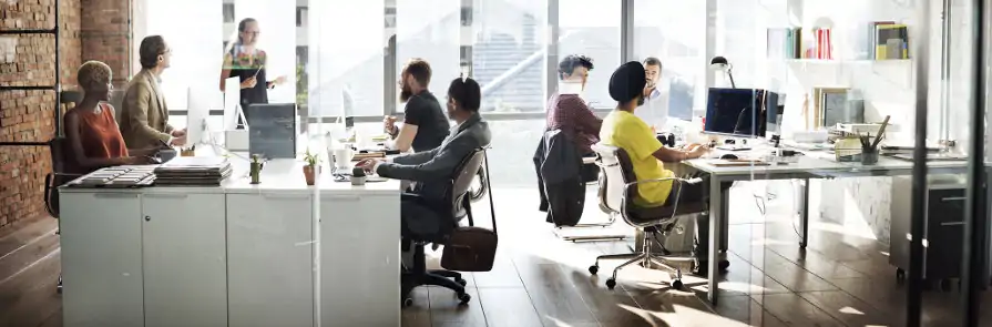 diverse group of employees working in shared office space