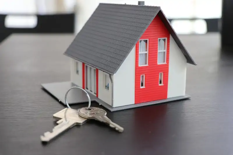 small model of house with keys on ring