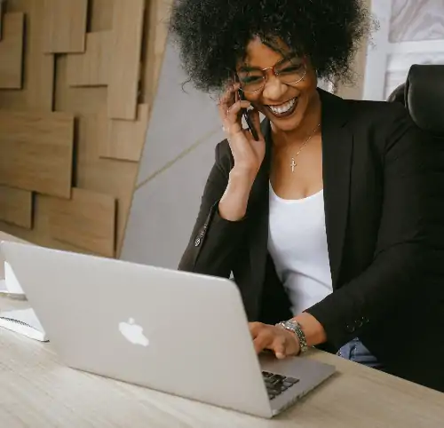 african-american businesswoman talking on smartphone in office