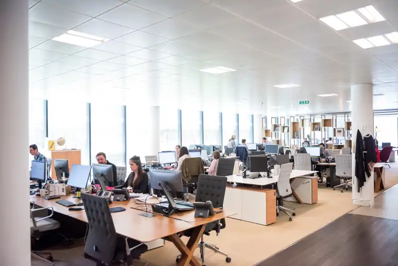 interior of office building with many workers