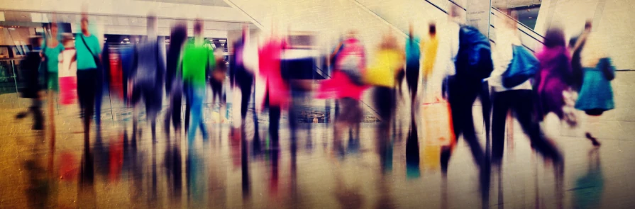 group of shoppers in motion at mall