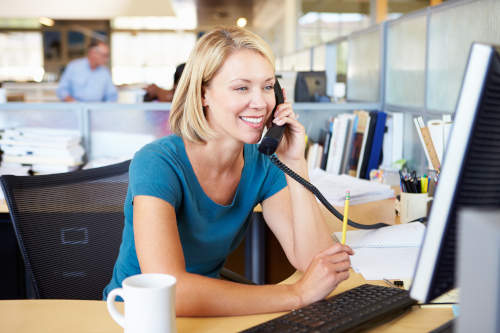 woman on voip phone talking to customer